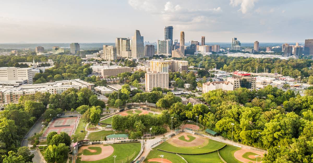 An aerial view of a community with a park made up of baseball fields and tennis courts outside Atlanta, Georgia.